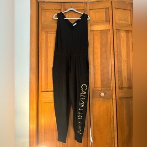 Calvin Klein black jumpsuit with gold foil logo